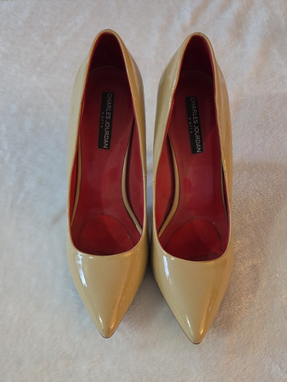 Charles Jourdan Patent Pointed-Toe Pumps in Cream with Red Interior